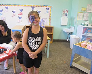 Neighbors | Alexis Bartolomucci.Leighna got a flower painted on her face during the Open House Carnival at Hitchcock Woods Early Learning Center on July 16.