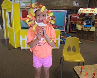 Neighbors | Alexis Bartolomucci.Addyson held up her lion mask she created on July 16 at Hitchcock Woods Early Learning Center during the Open House.