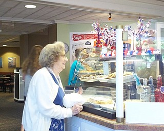 Neighbors | Submitted.Lois Schmidt was one of several visitors from the Blackburn Home who admired the goodies at Kravitz Deli in the Poland library.