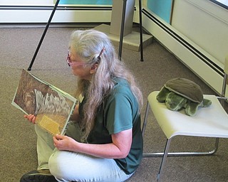 Neighbors | Zack Shively.Marilyn Williams reads a book about eastern box turtles to children in the Ford Nature Center on Aug. 10 for Children's Nature Hour.