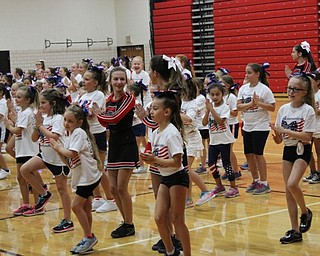 Neighbors | Abby Slanker.Canfield High School cheerleaders and Kiddie Cheer Camp attendees performed a group dance for family and friends on Aug. 9.