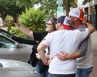 Kelly Passmore of Newton Falls takes a selfie with Ryan Moore(center) and Joe Ross, both of Howland before the Zac Brown Band performs at Stambaugh Stadium, Thursday, August 24, 2017 in downtown Youngstown...(Nikos Frazier | The Vindicator)