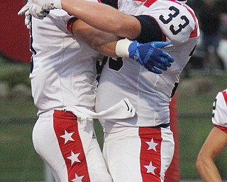 William D. Lewis The Vindicator Niles Nate Fowler(3) gets congrats from David Mays(33) after scoring during 1rst half action at Girard 8-24-17.