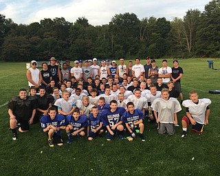 Neighbors | Submitted.Pictured are all of the Poland Little Bulldog teams with football players from Poland Seminary High School during a Big Dog Little Dog practice. The high school players spent an evening working with the younger players on drills and speaking to them about their own experiences within the Little Bulldogs.