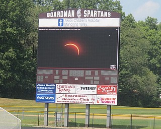 Neighbors | Zack Shively  .Boardman High School hosted a viewing event for Aug. 21's solar eclipse at Spartan Stadium. They live streamed the New York Times's live video of the eclipse while their prepared their own camera for the event.