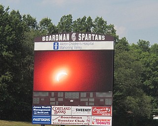 Neighbors | Zack Shively  .Boardman High School set up a live feed to show the eclipse in real time for those without protective sunglasses on Aug. 21 at Spartan Stadium. The stream can be found on the Boardman Schools Television Network (BSTN) YouTube page.