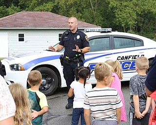 Neighbors | Abby Slanker.Canfield Local Schools Resource Officer Steve Garstka of the Canfield Police Department focused on teaching in-coming kindergarten students pedestrian and stranger safety during Canfield PTO’s Kindergarten Safety Day.