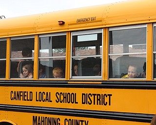 Neighbors | Abby Slanker.In-coming C.H. Campbell Elementary School kindergartners peered out the windows and waved to their parents after they boarded the bus to take a ride to the school during Canfield PTO’s Kindergarten Safety Day on Aug. 19.
