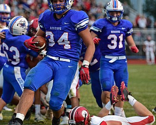BERLIN CENTER, OHIO - AUGUST 24, 2017: Western Reserve's Jack Cappabianca high steps into the end zone to score a touchdown after breaking a would by tackle from Columbiana's Jarrett Nemick during the first half of their game against Columbiana, Thursday night at Western Reserve High School. DAVID DERMER | THE VINDICATOR