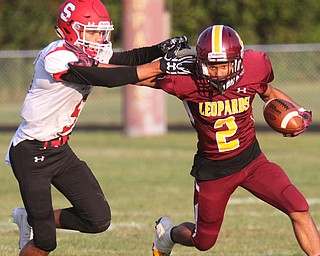 William D. Lewis The Vindicator Liberty's Capone Hayward(2) eludes Struthers' Tyrese Hawkins(5) during 1rst half action 8-25-17 at Liberty.
