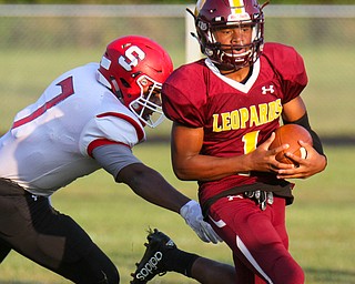William D.Lewis The Vindicator  Liberty's Dra Rushton(1) eludes Struthers' Willie Mitchell(7) during 1rst half action 8-25-17 at Liberty.