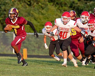 William D.Lewis The Vindicator  Liberty's Dra Rushton(1) eludes Struthers' Nate Richards(40) and other Wildcat defenders during 1rst half action 8-25-17 at Liberty.