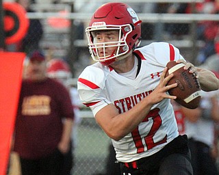 William D.Lewis The Vindicator Struthers QB JD Hall(12) looks downfield during 1rst half action 8-25-17 at Liberty.