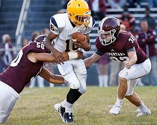 MICHAEL G TAYLOR | THE VINDICATOR-8-25-17 FOOTBALL Youngstown Golden Bears vs Boardman Spartans at Rayen Stadium, Youngstown, OH 2nd qtr., Boardman's #50 Steven Amstutz and #32 Neil Bevacqua sack East's qb #16 Thomas Steele.