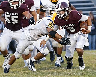 MICHAEL G TAYLOR | THE VINDICATOR-8-25-17 FOOTBALL Youngstown Golden Bears vs Boardman Spartans at Rayen Stadium, Youngstown, OH 2nd qtr., Boardman's #8 Michael O'Horo gains the 1st down as East''s #22 Mikese Stevens applies the hit.