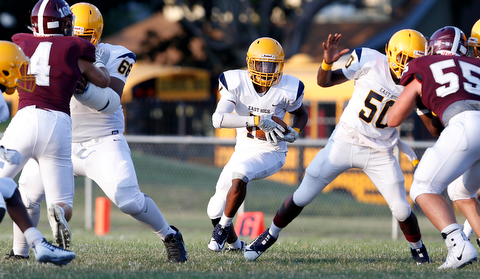 MICHAEL G TAYLOR | THE VINDICATOR-8-25-17 FOOTBALL Youngstown Golden Bears vs Boardman Spartans at Rayen Stadium, Youngstown, OH    1st qtr., East''s #15 Marcus Finkley runs for a 1st down.