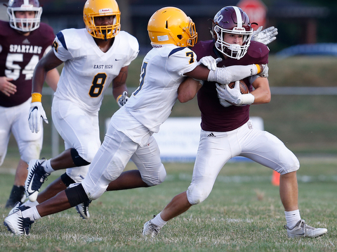 MICHAEL G TAYLOR | THE VINDICATOR-8-25-17 FOOTBALL Youngstown Golden Bears vs Boardman Spartans at Rayen Stadium, Youngstown, OH    1st qtr.,  Boardman's #6 Joe Ieraci is tackled by East''s #7 Jawan Showers.