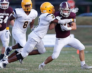 MICHAEL G TAYLOR | THE VINDICATOR-8-25-17 FOOTBALL Youngstown Golden Bears vs Boardman Spartans at Rayen Stadium, Youngstown, OH    1st qtr.,  Boardman's #6 Joe Ieraci is tackled by East''s #7 Jawan Showers.