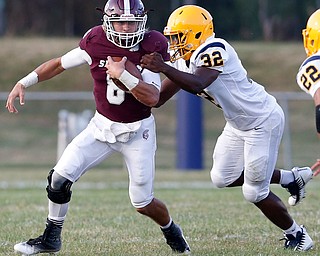 MICHAEL G TAYLOR | THE VINDICATOR-8-25-17 FOOTBALL Youngstown Golden Bears vs Boardman Spartans at Rayen Stadium, Youngstown, OH 2nd qtr., Boardman's #8 Michael O'Horo is tackled by East''s #32 Tavaris Shaw.
