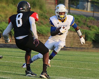 Valley Chrisitan's Jamynk Jackson(7) jukes past Campbell MemorialsMalachi Bannan (8) during the first quarter of Friday nights matchup at Campbell Memorial High School.  Dustin Livesay  |  The Vindicator  8/25/17  Campbell