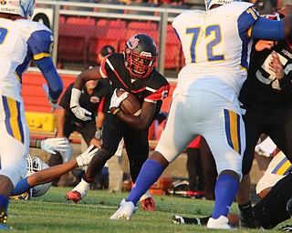 Campbell Memorial's Brandon Liggens (6) shakes a tackle while looking upfield during the first quarter of Friday nights matchup at Campbell Memorial High School.  Dustin Livesay  |  The Vindicator  8/25/17  Campbell