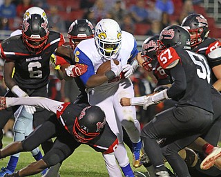 Valley Christian'sTrevon Clay(6) drags a members of the Campbell defense for a first down Friday nights matchup at Campbell Memorial High School.  Dustin Livesay  |  The Vindicator  8/25/17  Campbell