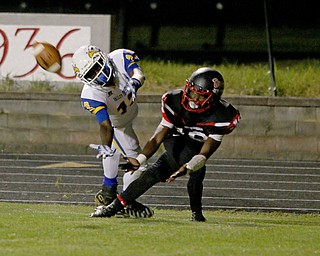Valley Chrisitan's Jaqwon Dow(13) and Christian Stores of Campbell fight for position on a pass during the third quarter of Friday nights matchup at Campbell Memorial High School.  Dustin Livesay  |  The Vindicator  8/25/17  Campbell