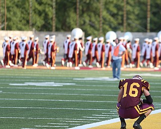 South Range Raiders wide receiver Alec Ballentine (16) kneels before Springfield local takes on South Range, Saturday, August 26, 2017, at Raider's stadium at the Rominger Sports Complex in Canfield...(Nikos Frazier | The Vindicator)..