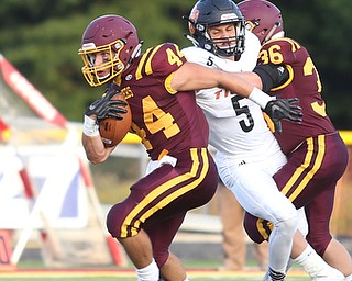 South Range Raiders running back Peyton Remish  (44) evades Springfield Local Tiger running back Ryan Ohlin  (5) with the help of South Range Raiders running back Trent Harrold  (36) during the first quarter as Springfield local takes on South Range, Saturday, August 26, 2017, at Raider's stadium at the Rominger Sports Complex in Canfield...(Nikos Frazier | The Vindicator)..