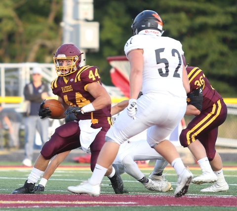 South Range Raiders running back Peyton Remish  (44) looks towards Springfield Local Tiger outside lineman Anthony Stouffer  (52) during the first quarter as Springfield local takes on South Range, Saturday, August 26, 2017, at Raider's stadium at the Rominger Sports Complex in Canfield...(Nikos Frazier | The Vindicator)..
