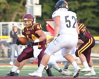 South Range Raiders running back Peyton Remish  (44) looks towards Springfield Local Tiger outside lineman Anthony Stouffer  (52) during the first quarter as Springfield local takes on South Range, Saturday, August 26, 2017, at Raider's stadium at the Rominger Sports Complex in Canfield...(Nikos Frazier | The Vindicator)..