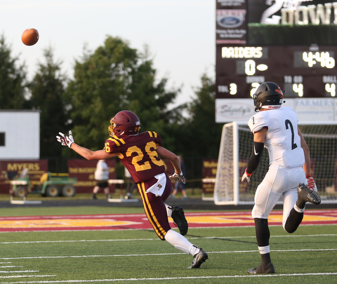 South Range Raiders wide receiver Brennan Toy  (26) reaches out for the pass as Springfield Local Tiger wide receiver  Evan Ohlin  (2) closes in during the first quarter as Springfield local takes on South Range, Saturday, August 26, 2017, at Raider's stadium at the Rominger Sports Complex in Canfield...(Nikos Frazier | The Vindicator)..