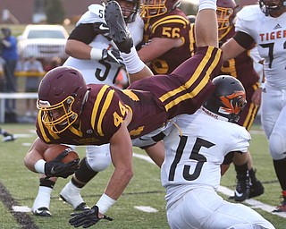 South Range Raiders running back Peyton Remish  (44) flips over Springfield Local Tiger running back Austin Trebella  (15) during the second quarter as Springfield local takes on South Range, Saturday, August 26, 2017, at Raider's stadium at the Rominger Sports Complex in Canfield...(Nikos Frazier | The Vindicator)..
