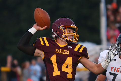 South Range Raiders quarterback Aniello Buzzacco  (14) throws during the second quarter as Springfield local takes on South Range, Saturday, August 26, 2017, at Raider's stadium at the Rominger Sports Complex in Canfield...(Nikos Frazier | The Vindicator)..