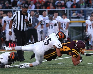 South Range Raiders running back Peyton Remish  (44) is taken down by Springfield Local Tiger running back Luke Snyder  (25) and Springfield Local Tiger quarterback  Brandon Walters  (3) during the second quarter as Springfield local takes on South Range, Saturday, August 26, 2017, at Raider's stadium at the Rominger Sports Complex in Canfield...(Nikos Frazier | The Vindicator)..