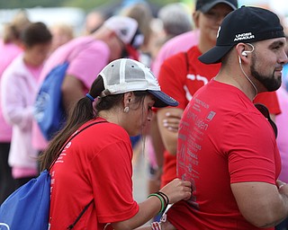 Taylor Watson(left) pins her brother, Corey Watson's bib before the 8th annual Panerathon, Sunday, August 27, 2017 at the Covelli Centre in Youngstown...(Nikos Frazier | The Vindicator)