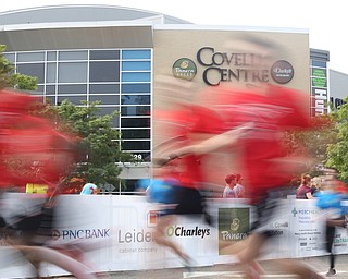 A slow shutter shows the 2 mile runners start the 8th annual Panerathon, Sunday, August 27, 2017 at the Covelli Centre in Youngstown...(Nikos Frazier | The Vindicator)