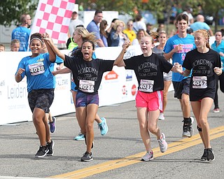 (from left) Boardman girls cross country runners; Sydney Freeman(14), Alayna Cuevas(14), Isabel Dryer(14) and Alannah Hetzel(14) complete the 2 mile run during the 8th annual Panerathon, Sunday, August 27, 2017 at the Covelli Centre in Youngstown...(Nikos Frazier | The Vindicator)