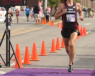 Juris Silenieks(24) of Pittsburgh, Pa. completes the 10k run during the 8th annual Panerathon, Sunday, August 27, 2017 at the Covelli Centre in Youngstown. Silenieks placed first with a time of 30:57.0 in the Open Men category. ..(Nikos Frazier | The Vindicator)