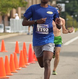 Chris Butler(19) of Boardman, completes the 10k run during the 8th annual Panerathon, Sunday, August 27, 2017 at the Covelli Centre in Youngstown. Butler placed first with a time of 34:49.2 in the Men 15 - 19 category. ..(Nikos Frazier | The Vindicator)