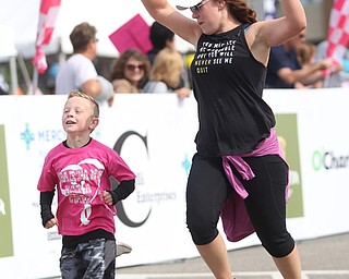 Stefanie Adams of Boardman completes the 2 mile run with her youngest son, Evan(6) during the 8th annual Panerathon, Sunday, August 27, 2017 at the Covelli Centre in Youngstown...(Nikos Frazier | The Vindicator)