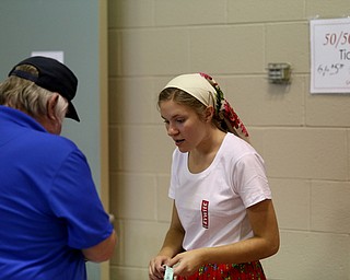 D'Ella Hechmeyer(17) sells tickets during the 9th annual Polish American heritage festival, Sunday, August 27, 2017, at St. Anne's catholic Church in Austintown...(Nikos Frazier | The Vindicator)