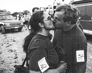 1992 Canfield Fair Demo Derby driver Andy Smeltzer of Youngstown gets a good luck kiss from his wife Edie Smeltzer before the derby 09071992.