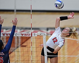 YOUNGSTWON, OHIO - AUGUST 29, 2017: Youngstown State's Margaux Thompson, right, hits the ball over Robert Morris's Skylar Clements during their match Tuesday night at Beeghly Center. DAVID DERMER | THE VINDICATOR