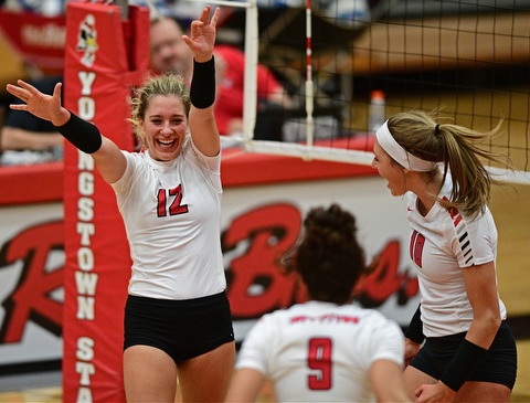 YOUNGSTWON, OHIO - AUGUST 29, 2017: Youngstown State's Margaux Thompson, left, celebrates after scoring a point with Erin Kalahar and Libbie Darling during their match Tuesday night at Beeghly Center. DAVID DERMER | THE VINDICATOR