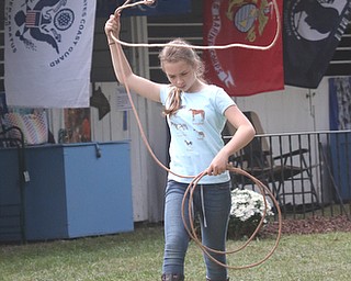     ROBERT K. YOSAY  | THE VINDICATOR..171st Canfield Fair is underway ..  as Eliyana SHank 11 of Berlin Center - with Mahoning Valley Horseman 4-H as she practices for the GROUND ROPING class