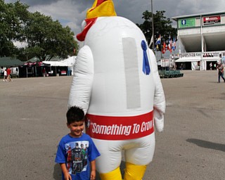     ROBERT K. YOSAY  | THE VINDICATOR..171st Canfield Fair is underway ..  as  Kalea Hall  was the Rooster of the 171 st.... with him.. is the Javi Zayas  4 of Canfield.. poses with the rooooooster