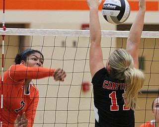 William D. Lewis The Vindicator Howland's Faith Grant(7) returns a shot past Canfield's Alyssa Householder(11)) during 8-3--17 action at Howland.
