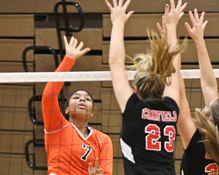 William D. Lewis The Vindicator Howland's Faith Grant(7) returns a shot past Canfield's Natalie Maras(23) during 8-3--17 action at Howland.