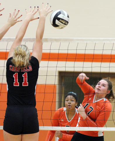 William D. Lewis The Vindicator Howland's Haley Vandergrift(17) Faith Grant(7) returns a shot past Canfield's Alyssa Householder(11) during 8-3--17 action at Howland.Howland's Faith Grant(7) is in background.